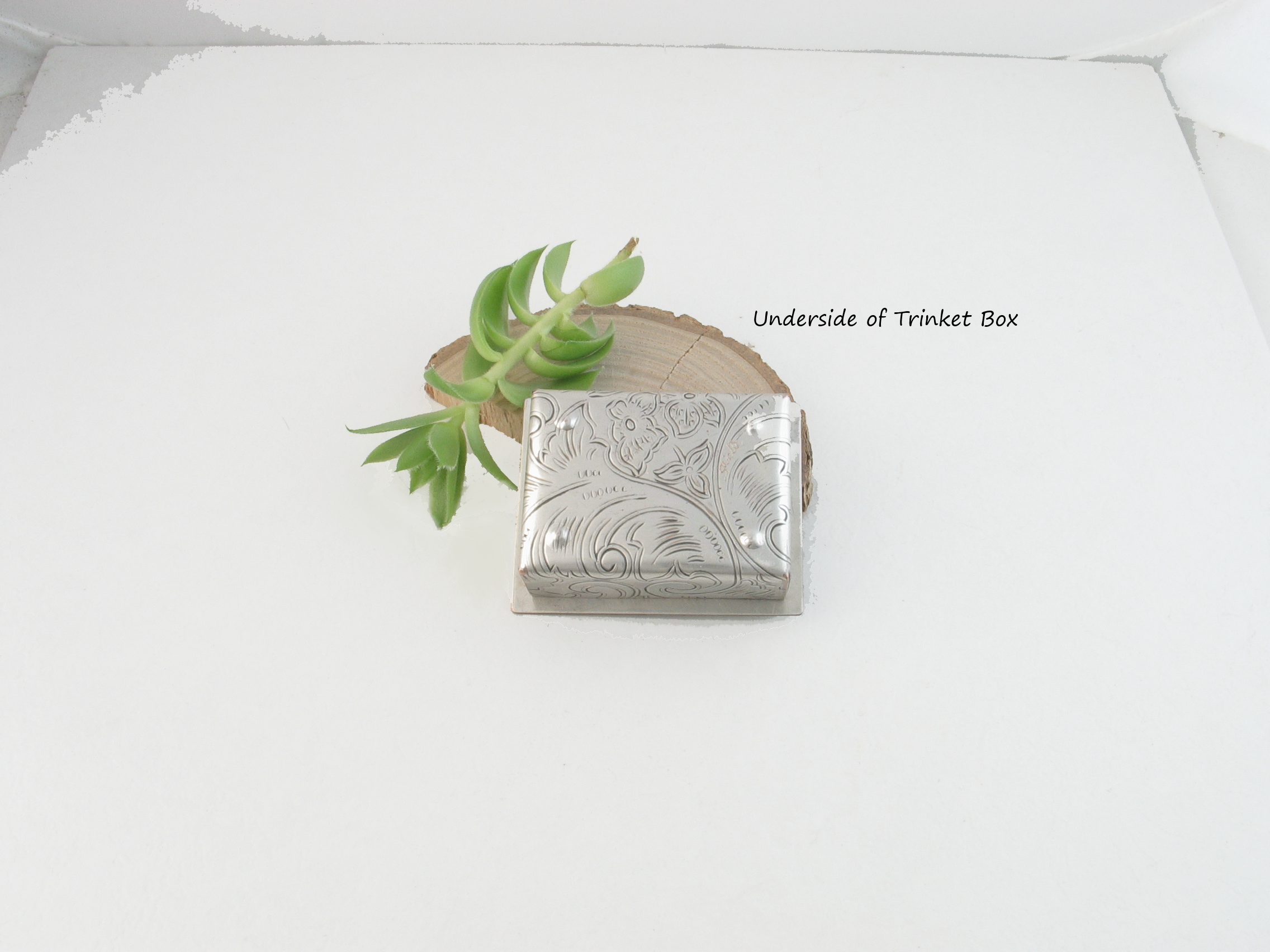 tiny silver trinket box with aquamarine gemstone