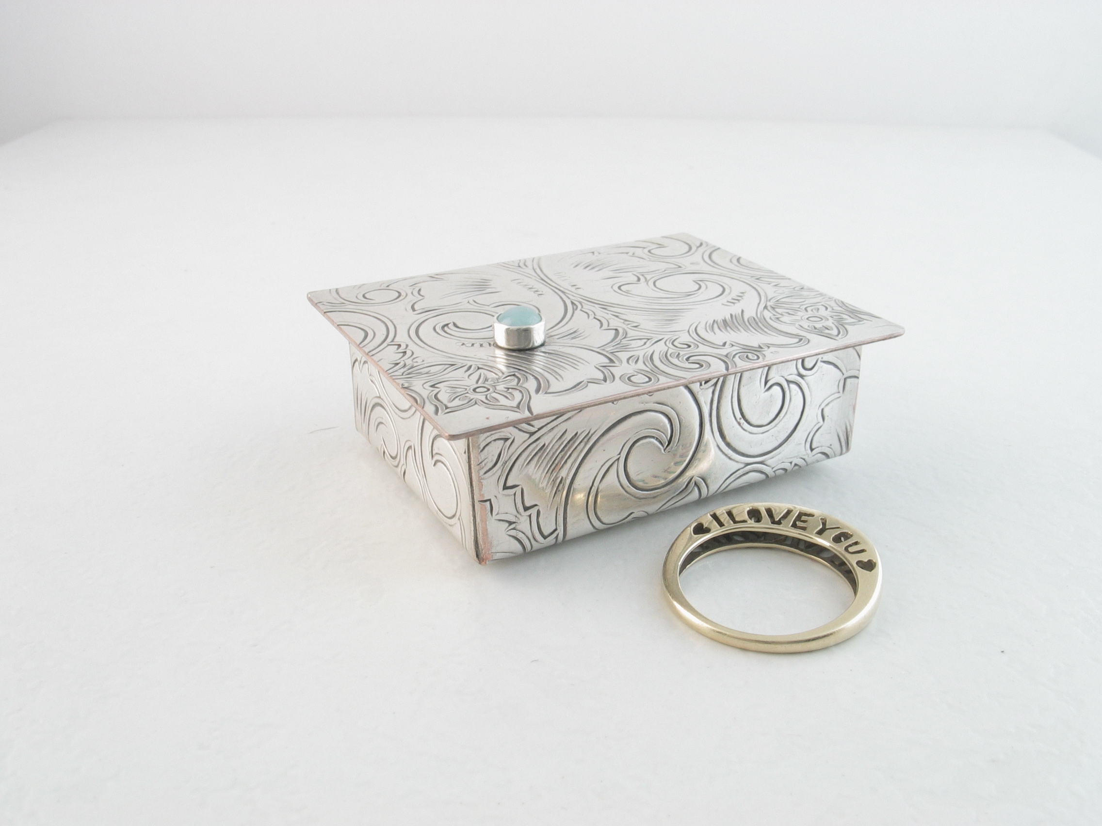 tiny silver trinket box with aquamarine gemstone