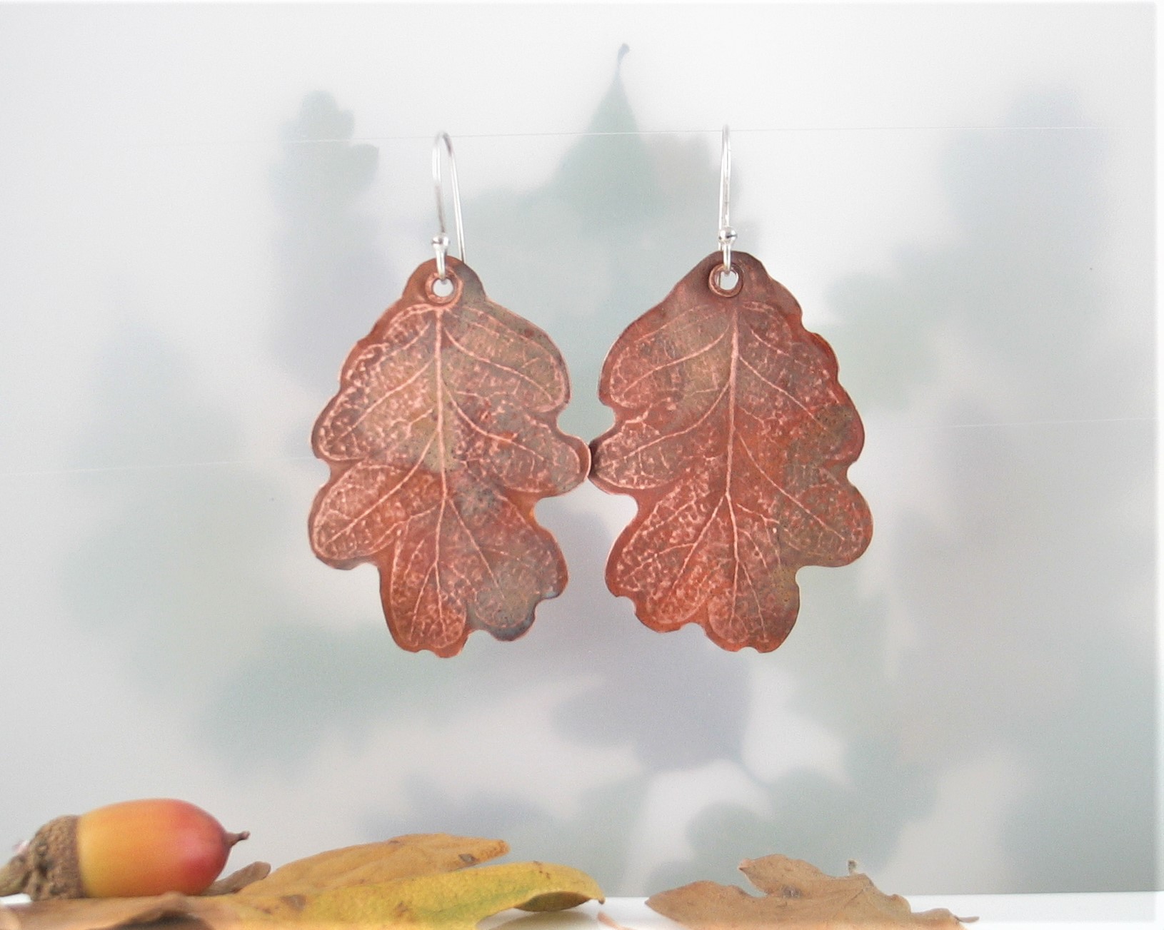 Small Copper oak shaped dangle earrings